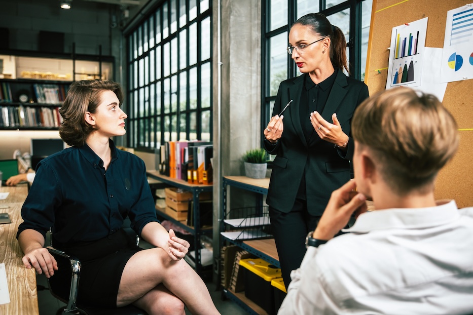 Three people meeting Leadership Coaching