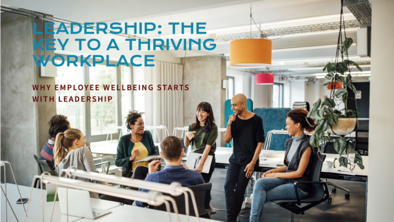 leadership-wellbeing-impact A supportive leader fostering employee wellbeing through workplace culture